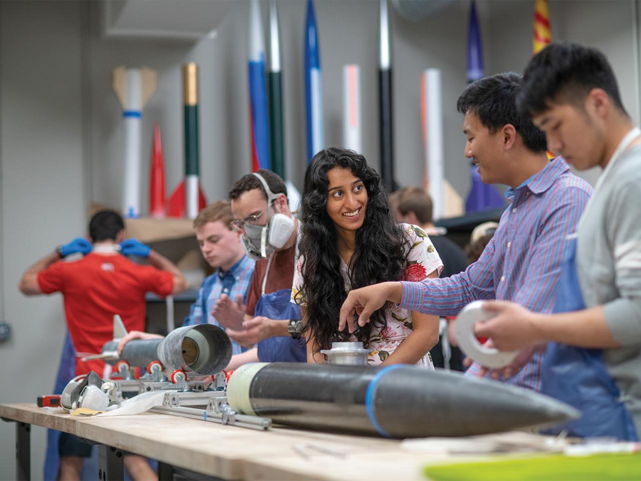 Student building a rocket in Center for Design and Manufacturing Excellence