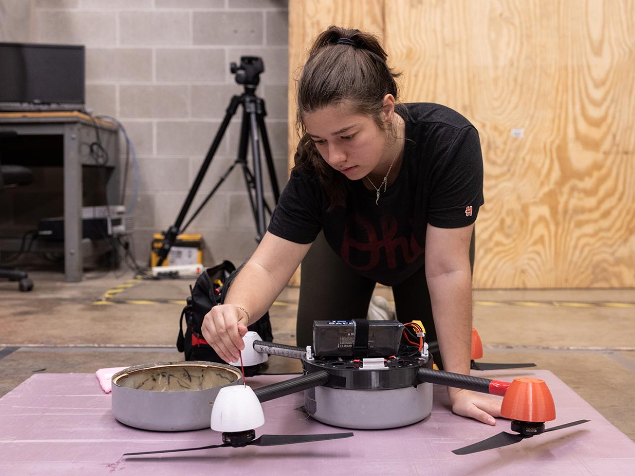 PhD student Sage Herz gets a drone ready for a test flight at the Aerospace Research Center