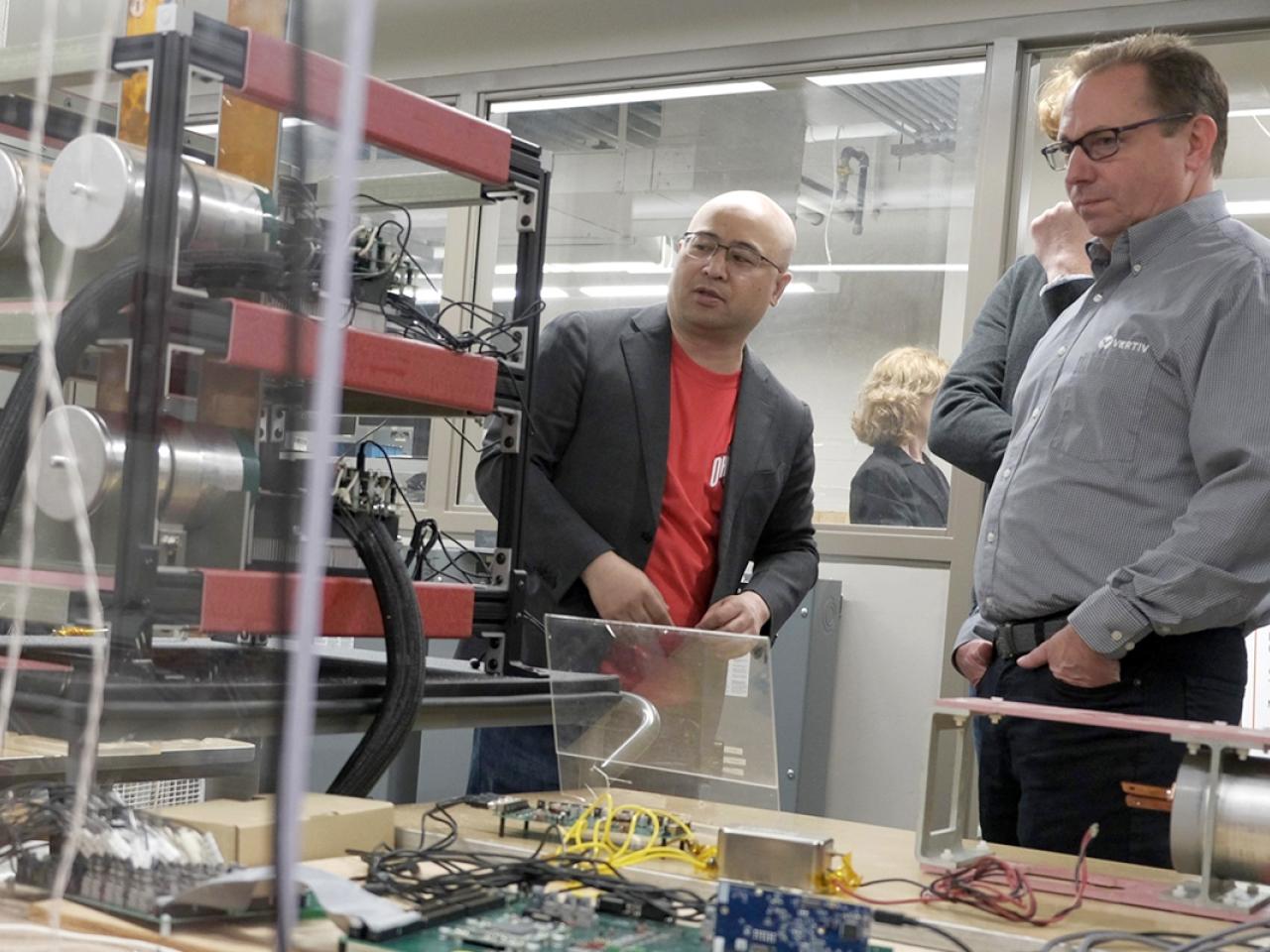 Jin Wang and Vertiv corporate representatives in Center for High Performance Power Electronics lab