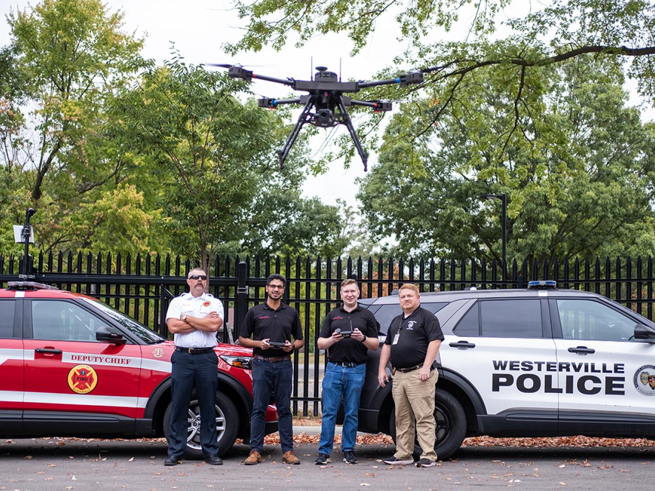 Parawave founders Adithya Ramaswami and Jack Murray demonstrate their drone invention with Westerville Detective Lieutenant Justin Alloway and Deputy Fire Chief Robert Morton at the Westerville Division of Police. ParaWave is a startup focused on creating drones for first responders to help out during emergencies.