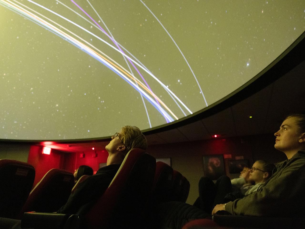 Students watching a space tour at the Arne Slettebak Planetarium at Ohio State in Smith Lab.