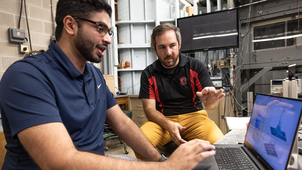 Matt McCrink (right) works with Adithya Ramaswami to access drone data at the Aerospace Research Center.