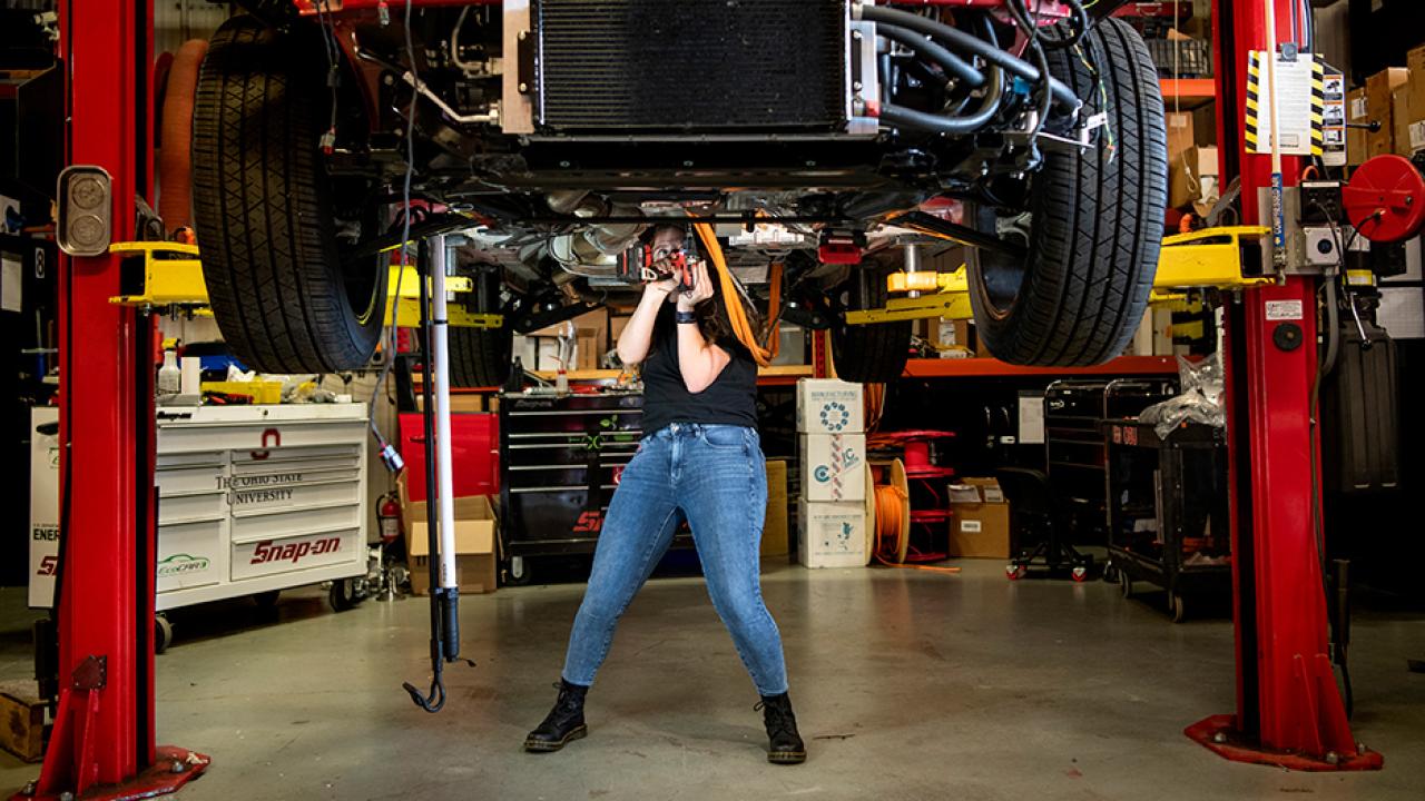 Female student working on Ohio State’s EcoCar Challenge vehicle